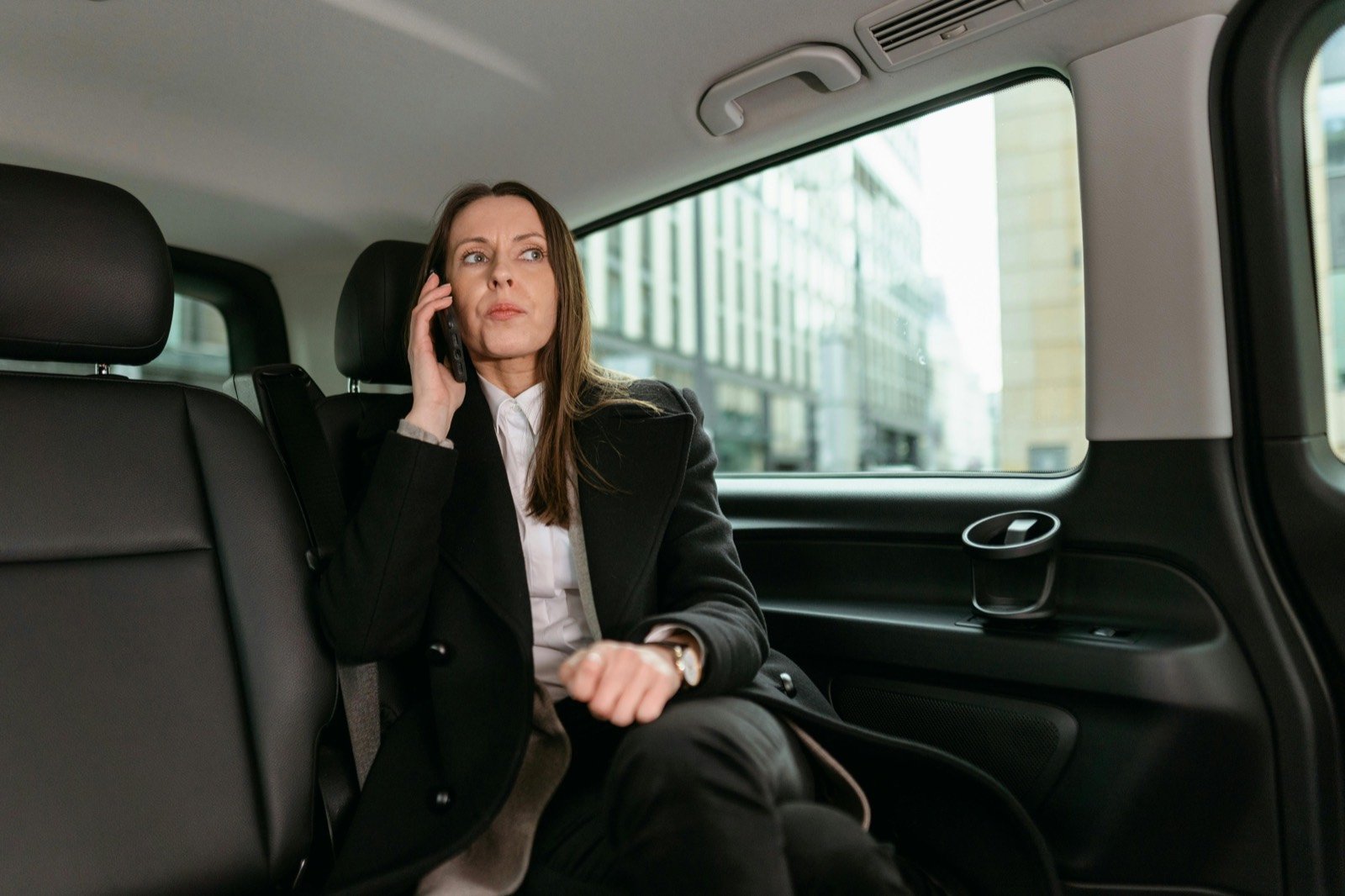 Passenger riding in the back of a taxi